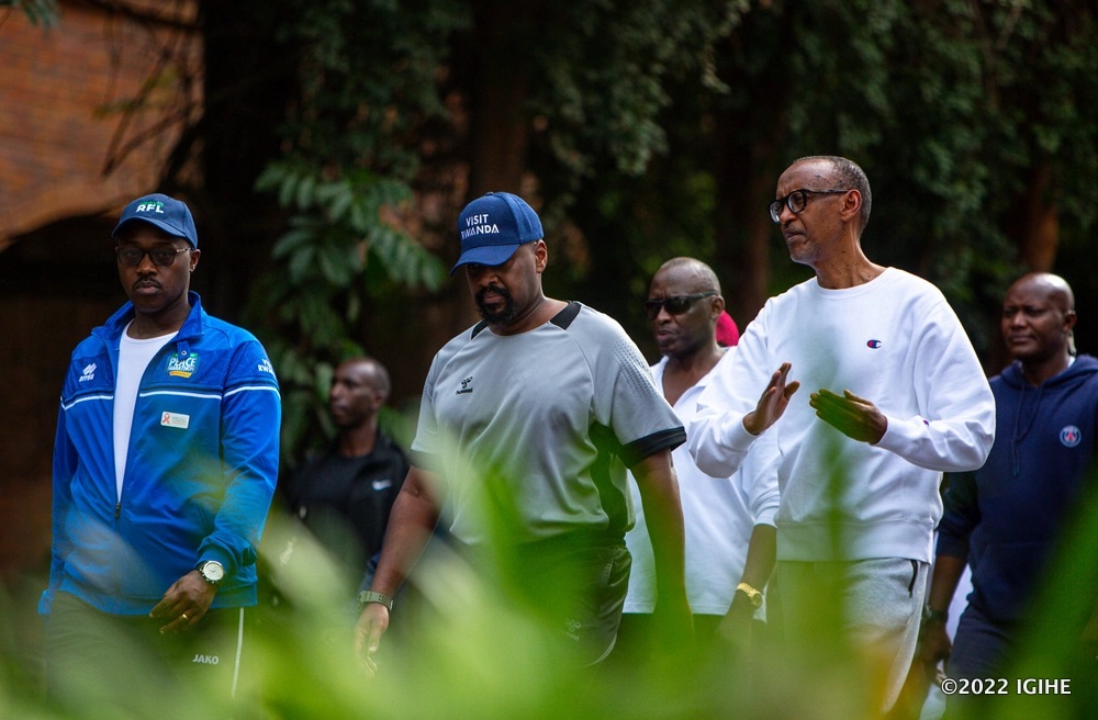 President Kagame conversing with Gen Muhoozi during the mass sporting event as the Mayor of Kigali City, Pudence Rubingisa looks on. 