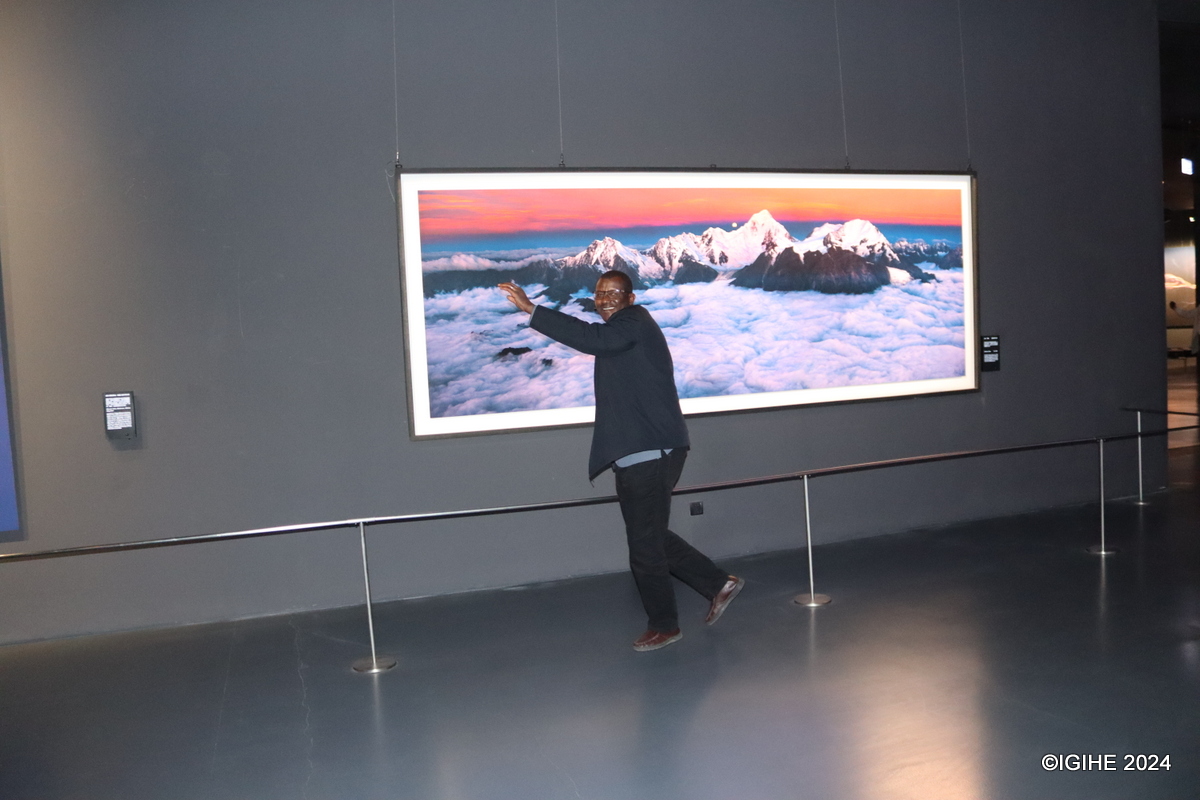 A visitor posing for a photo inside the photography museum.