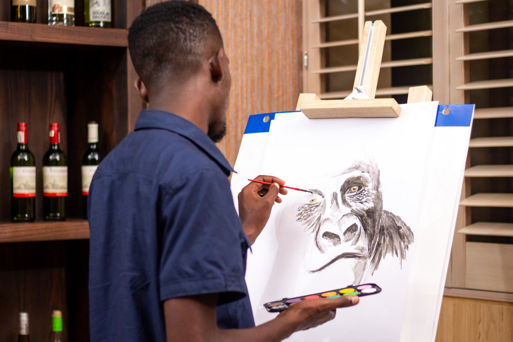 Artist Rigobert Uwiduhaye, the instructor who guided guests at the Picasso night. also provided a live-painting session