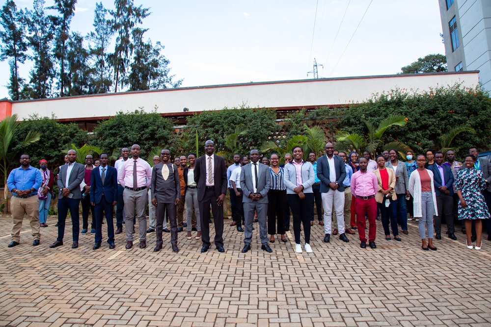 The Minister of State in charge of ICT and TVET, Claudette Irere with the school's management and students. 