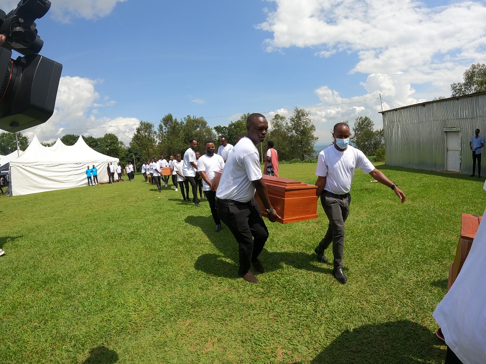 Mourners carrying caskets containing remains of victims of Genocide against Tutsi during a recent commemoration event in Kigali.