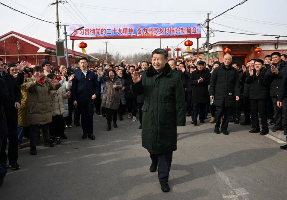 Chinese President Xi Jinping, also general secretary of the Communist Party of China Central Committee and chairman of the Central Military Commission, waves to villagers while visiting a village in Xinkou Town in Xiqing District of north China's Tianjin Municipality, Feb. 1, 2024. (Xinhua/Xie Huanchi)
