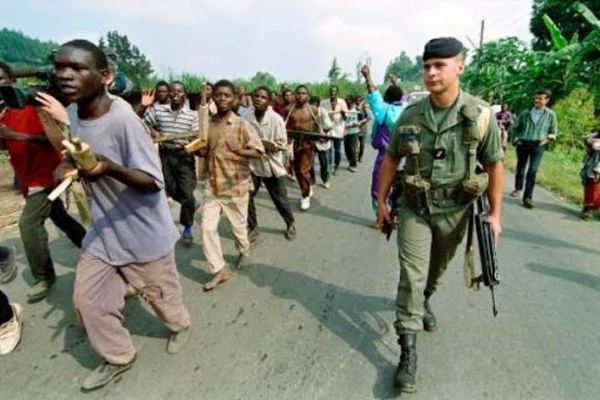 French soldiers training Interahamwe to handle guns