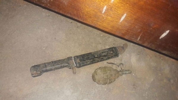 A grenade and a military bayonet reported to have been found under the bed of retired soldier, Nzabihimana Jean