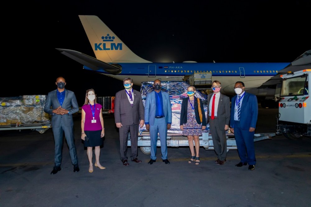 Officials from Rwanda and delegates from US Embassy in Rwanda in a group photo as they received the first batch of COVID-19 vaccine doses at Kigali International Airport.  
