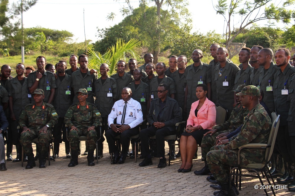 Indangamirwa in a group photo with officials during the launch of 10th session of their civic education