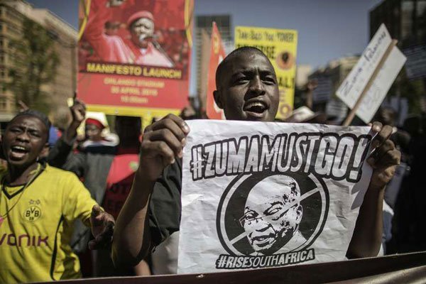 A man shouts slogans as people take to the streets protesting against South African President Jacob Zuma and the ruling African National Congress (ANC) party during a rally organised by the opposition political parties, Civil Society organisations and religious groups as the nation celebrates Freedom Day in Johannesburg on April 27, 2016.