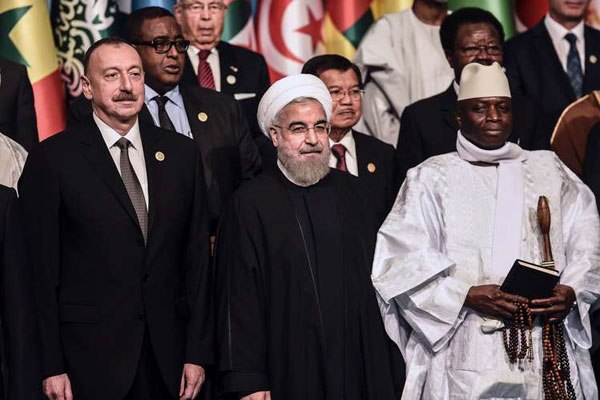 Azerbaijani President Ilham Aliyev (left), Iranian President Hassan Rouhani (centre) and President of Gambia Yahya Jammeh (right) pose for a photograph during a family photo of 13th Organization of Islamic Cooperation (OIC) Summit at Istanbul Congress Center (ICC) on April 14, 2016.