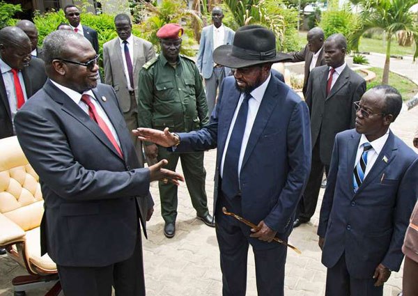 South Sudan Vice President Riek Machar (left) shakes hands with President Salva Kiir after the formation of the new cabinet of the Transitional Government at the Cabinet Affairs Ministry in Juba on April 29, 2016. Dozens of prisoners in South Sudan are being held in conditions amounting to torture, crammed into metal containers in baking heat with minimal water and food, Amnesty International said Friday.