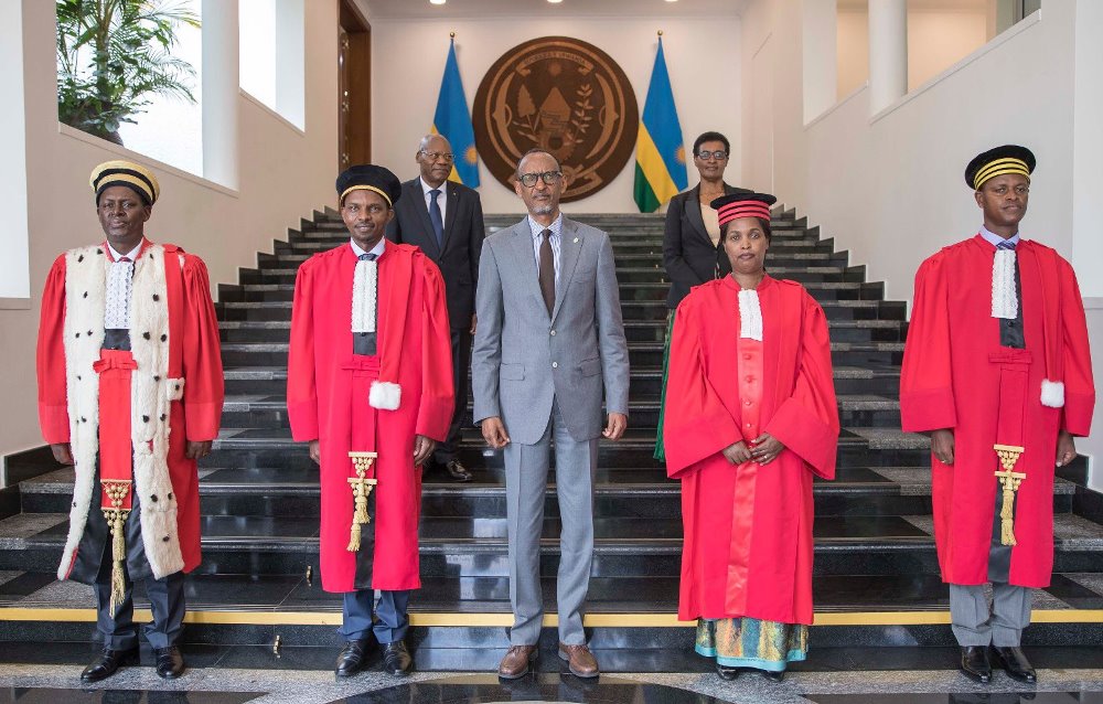 President Paul Kagame in a group photo with newly sworn-in members of the judiciary.
