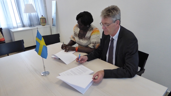 Judith and Michael sign agreements