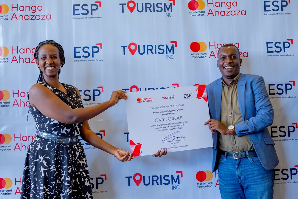 One of graduates receiving certificate of completion.