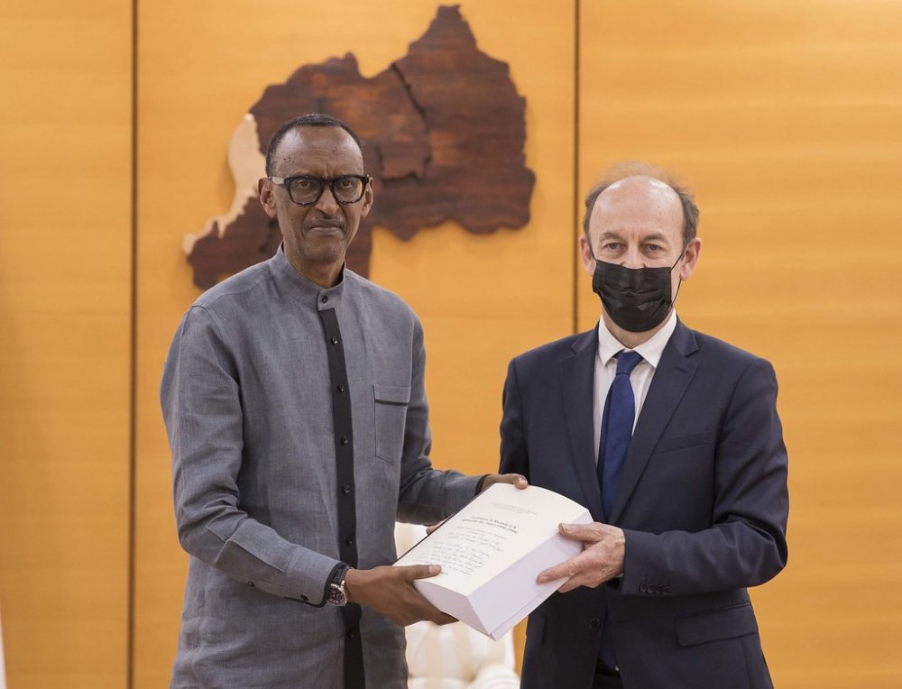 President Kagame receiving Duclert report. Photo Village Urugwiro
