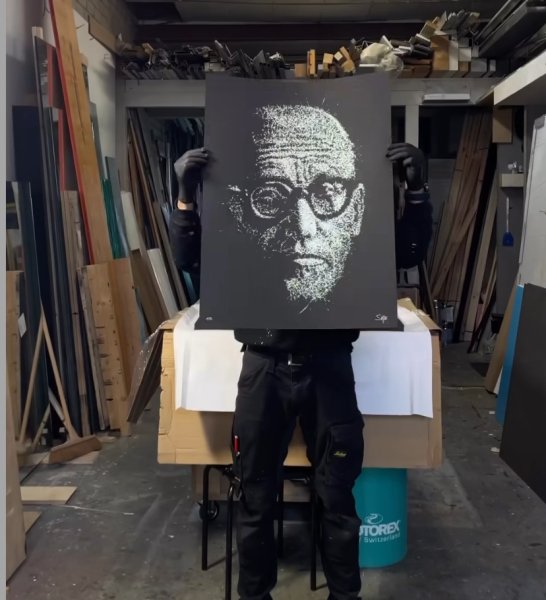 Simon Burger an artist has created an art piece Of President Kagame Paul is a shuttered Glass