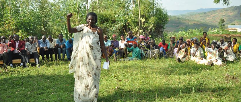 A resident of Muganza cheering during Umugoroba w'ababyeyi.