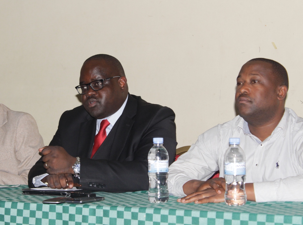 Kavaruganda (L) speaks to the media yesterday