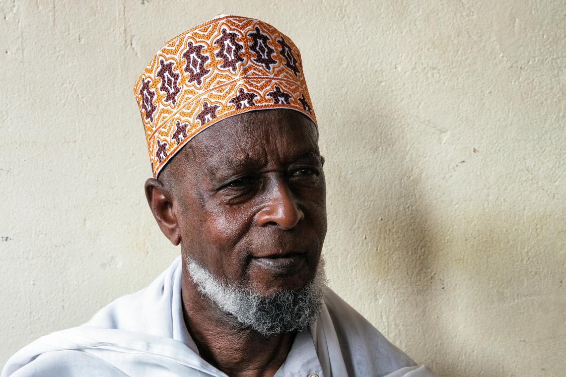 Kayijuka Asumani, 83, is an Elder at Moskit Madina in the centre of Rwanda's capital, Kigali. He has learnt a lot about Ebola prevention from Friday prayers, when the Imam peppers religious messages with Ebola awareness information.