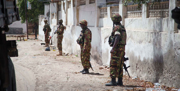 Kenyan soldiers serving with the African Union Mission in Somalia (Amisom) on patrol in Kismayu, Somalia. The mission's top leadership says that some of its programmes have stalled due to lack of funding.