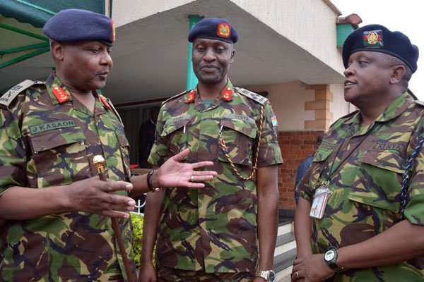 Vice Chief of the Kenya Defence Forces Lt-General Joseph Kasaon (left) chats with Chief Recruiting Officer Brigadier Kiugu Muthuri (center) and Spokesperson Lt-Col Paul Njuguna at the Department of Defence in Nairobi on September 19, 2016. The military has confirmed it was in full control of the Kulbiyow camp in Somalia.