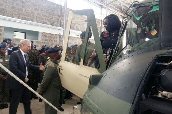 The US Ambassador to Kenya Robert Godec (left) hands over six helicopters to Defence Cabinet Secretary Raychelle Omamo at the Laikipia Air Base in Nanyuki on December 2, 2016.