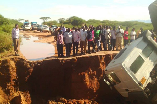 Travellers stranded after El Niño rains swept off a road at Kambi Karai, a few kilometres from the Marich Trading Centre, in West Pokot County