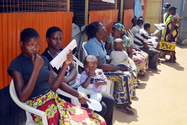Patients await medical check ups during the launch of Kenya Tuberculosis Prevalence Survey for 2015-2016 in Mshomoroni, Mombasa County, on September 25, 2015.