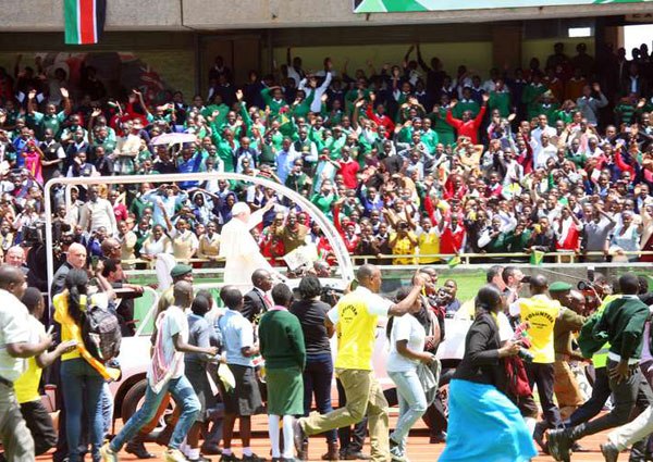Pope Francis waves at youths after addressing them at Safaricom Stadium in Kasarani, Nairobi, on November 27, 2015. The biggest challenges the youth and the country are facing are tribalism and corruption.