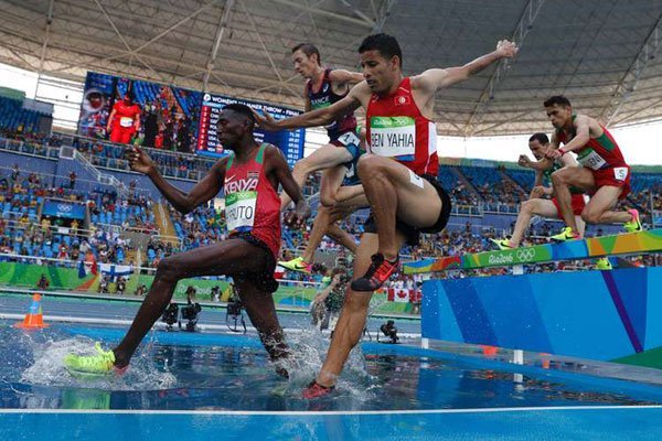 From left: Kenya's Conseslus Kipruto, France's Yoann Kowal, Tunisia's Amor Ben Yahia compete in the Men's 3000m Steeplechase Round 1 during the athletics competition at the Rio 2016 Olympic Games at the Olympic Stadium in Rio de Janeiro on August 15, 2016.