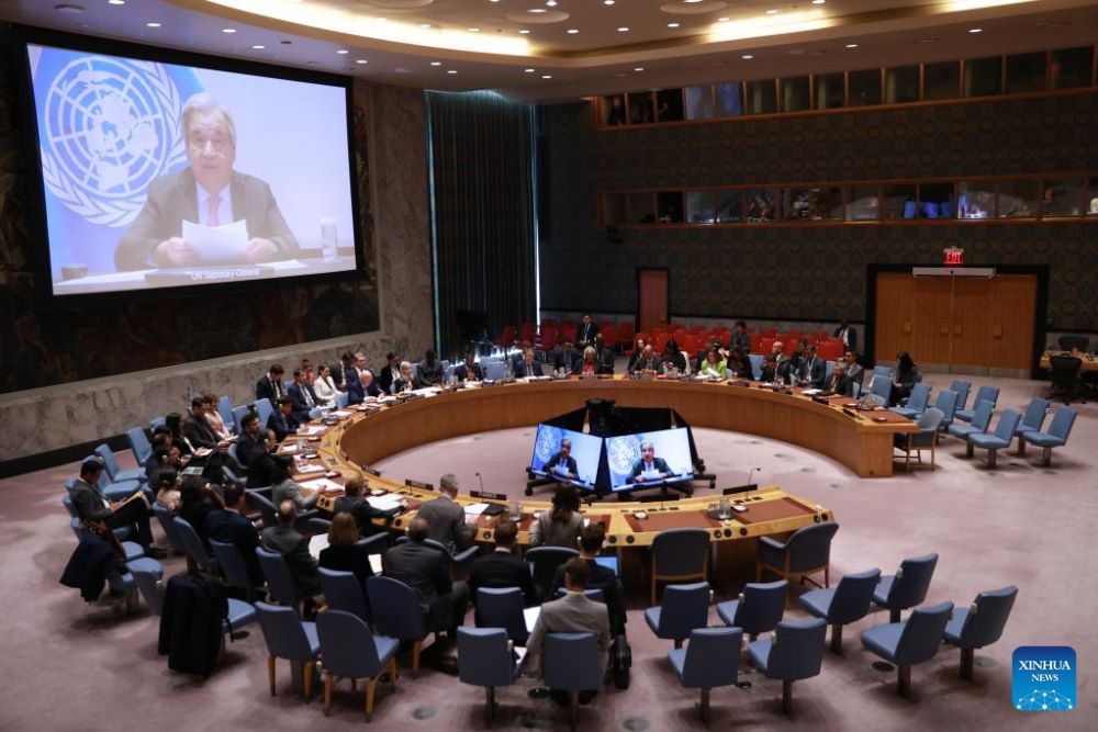 UN Secretary-General Antonio Guterres (on screens) speaks via a video link at an open debate of the Security Council on the future of the UN at the UN headquarters in New York, Oct. 24, 2025. Guterres called on the Security Council to channel the resources often spent on war to development and peace on Friday.