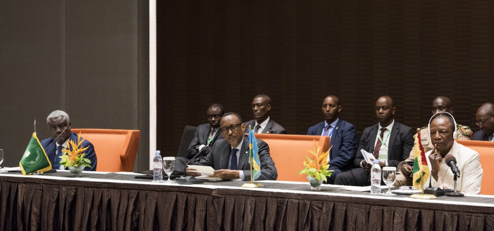 The African Union Commission Chairperson ,Mahamat Moussa Faki (on the left), Presidents Paul Kagame and Alpha Conde, the current Chairperson of the African Union.