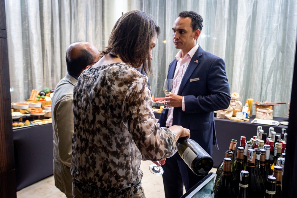 Kigali Marriott’s Food and Beverage Director, Simon Hodson (in front) interacts with the guests at the Wine Tasting Evening on Thursday