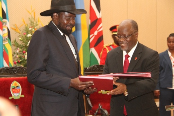 THE Chairman of the East African Community (EAC), President John Magufuli, exchanges documents with South Sudan President Salva Kiir, following the signing of a Treaty of Accession of the latter into the regional grouping in Dar es Salaam yesterday.