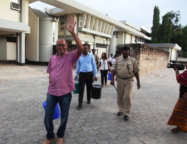 FORMER Commissioner General of Tanzania Revenue Authority (TRA) Harry Kitilya waves as he heads to board a prison vehicle on his way to Keko remand prison after being charged with money laundering at the Kisutu Resident Magistrate’s Court in Dar es Salaam yesterday. Behind him are co-accused Sioi Solomon and Shose Sinare. (Photo by Robert Okanda)