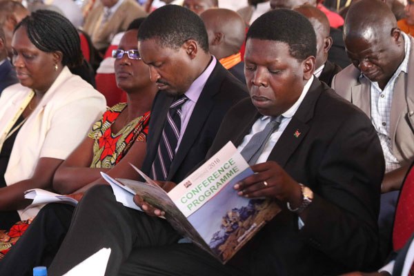 Water CS Eugene Wamalwa (left) and his Devolution counterpart Mwangi Kiunjuri follow proceedings during the third devolution conference in Meru on April 22, 2016.