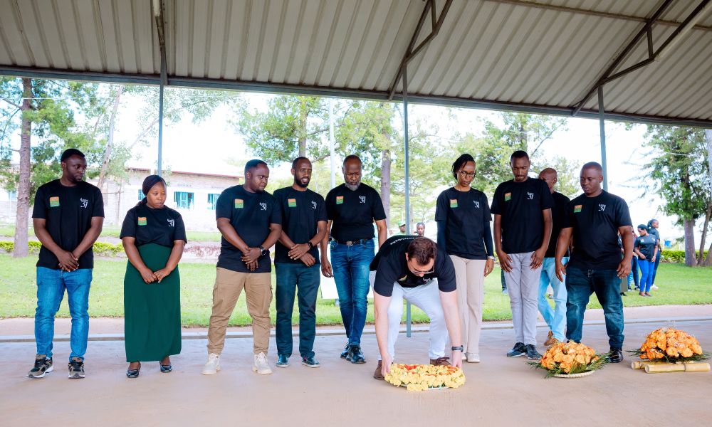 The entire Kinazi Cassava Plant Ltd team laid flowers on the grave as a symbol of remembrance.
