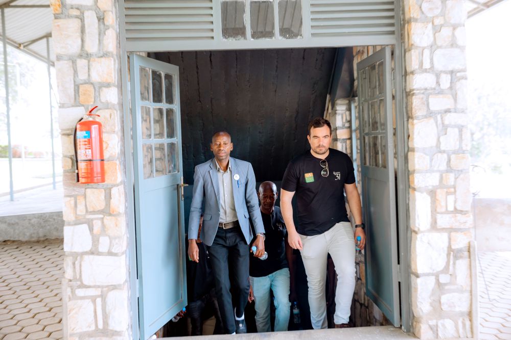 The CEO of Kinazi Cassava Plant, Alex Van De Langenberg in the company of Nzigiyimana Céléstin, the head of Ibuka in Kinazi.
