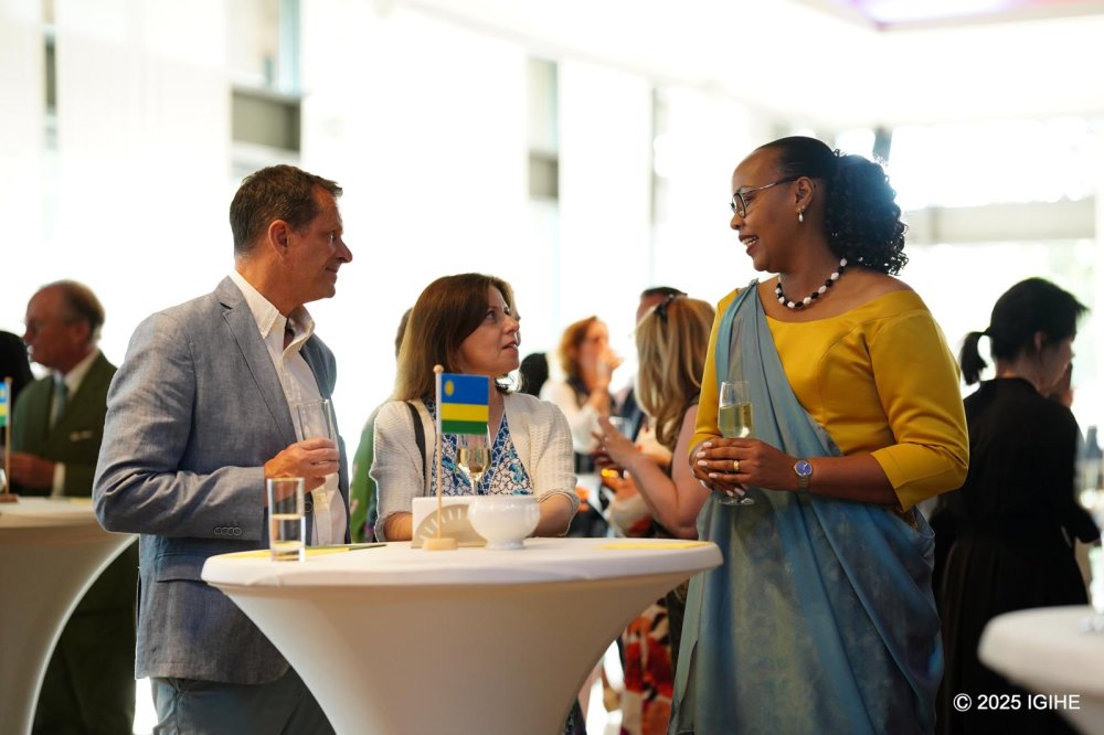 The Rwandan Ambassador to Luxembourg, Munyangaju, speaking with participants at the event.