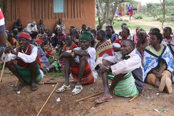 Villagers attend a meeting at Ewasu Primary School grounds on May 23, 2016. They evicted headteacher Ann Resiano for condemning one of her teachers for making a pupil pregnant.