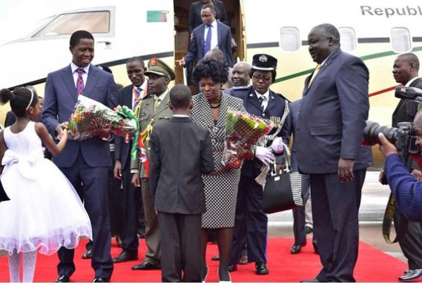 Zambian president Edgar Chagwa Lungu (L) arrives at Entebbe airport.