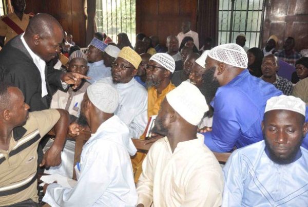Mr Twaha Mayanja of Mayanja Nakibule and Company Advocates, the law firm representing 12 Muslim clerics on remand over the killing of Muslim leaders two years ago, briefs his clients at the High Court recently.
