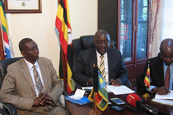 South Sudan's Minister for livestock and fisheries James Duku (L) and he's Ugandan Counterpart Hon. Vincent Ssempijja (R) addressing media after their meeting in Entebbe.