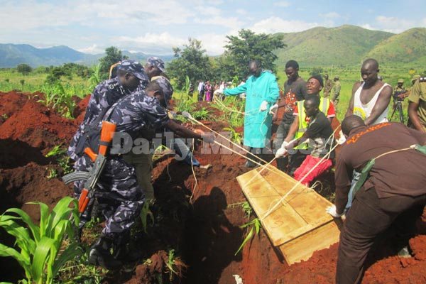 Police on Sunday buried the remains of 52 unclaimed bodies of victims of fresh Kasese clashes.