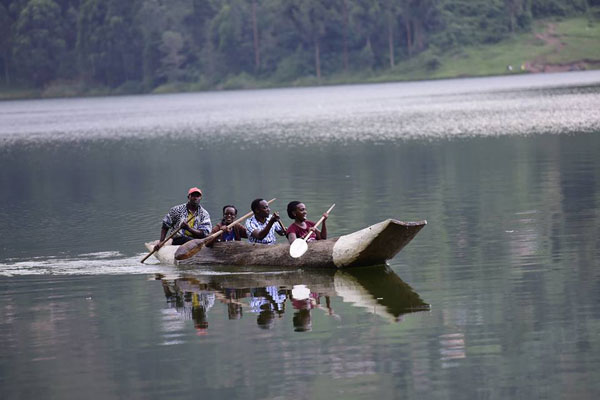 Local tourists canoeing on Lake Bunyonyi.