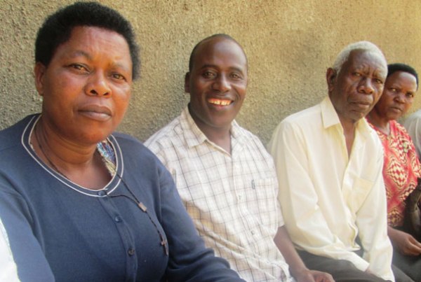 Mr Tweyambe (M) with some well-wishers who visited him at Ntungamo Police Station.