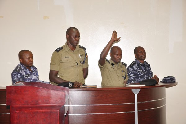 L-R Katwe Division Field Operations Commander, Patrick Muhumuza, Wandegeya Division Police Commander, Moses Nanoka, Kampala Metropolitan Police Field Force Commander, Samuel Bamuzibire, and Kampala Metropolitan Police South Commander, Andrew Kaggwa have been charged with use of excessive force to disperse supporters of former FDC presidential candidate, Dr Kizza Besigye, at the Police Disciplinary Court.