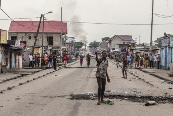 A man screams as people gather to protest in the neighbouhood of Yolo in Kinshasha on December 20. Similar protests have taken place in DR Congo as citizens oppose President Kabila's extended stay in power.