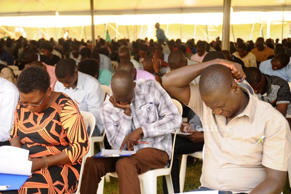 Some of the shortlisted applicants sit aptitude test for 124 Public Service job slots at Namboole stadium on May 4, 2017.