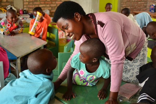 Laurence, the pre-primary teacher of Class Two, answers a question from one student.