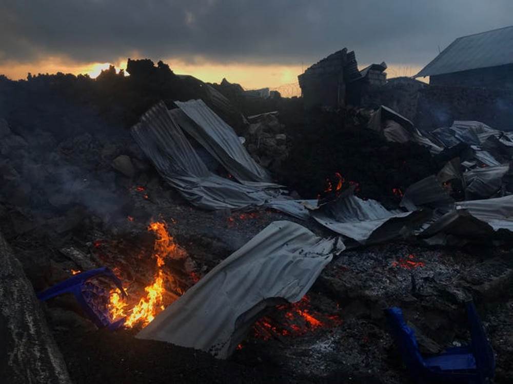 Smoldering ashes are seen early morning in Goma in the East of the Democratic Republic of Congo on May 23, 2021 following the eruption of Mount Nyiragongo. Moses Sawasawa, AFP via Getty Images