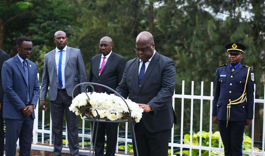 President Tshisekedi laying flowers at the burial place at Gisozi Memorial